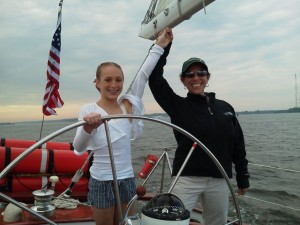 Amanda Gaskins at the helm of the Schooner Woodwind