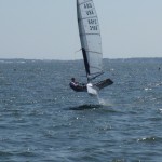 Moth Sailboat flying/sailing through the water