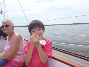 Emilio showing off his newly lost tooth on the Schooner Woodwind.
