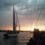 Great photo as Woodwind II passes us at sunset in Annapolis