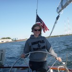 Lauren at the wheel of Schooner Woodwind